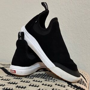 Vans Black and White Slip-On Sneakers